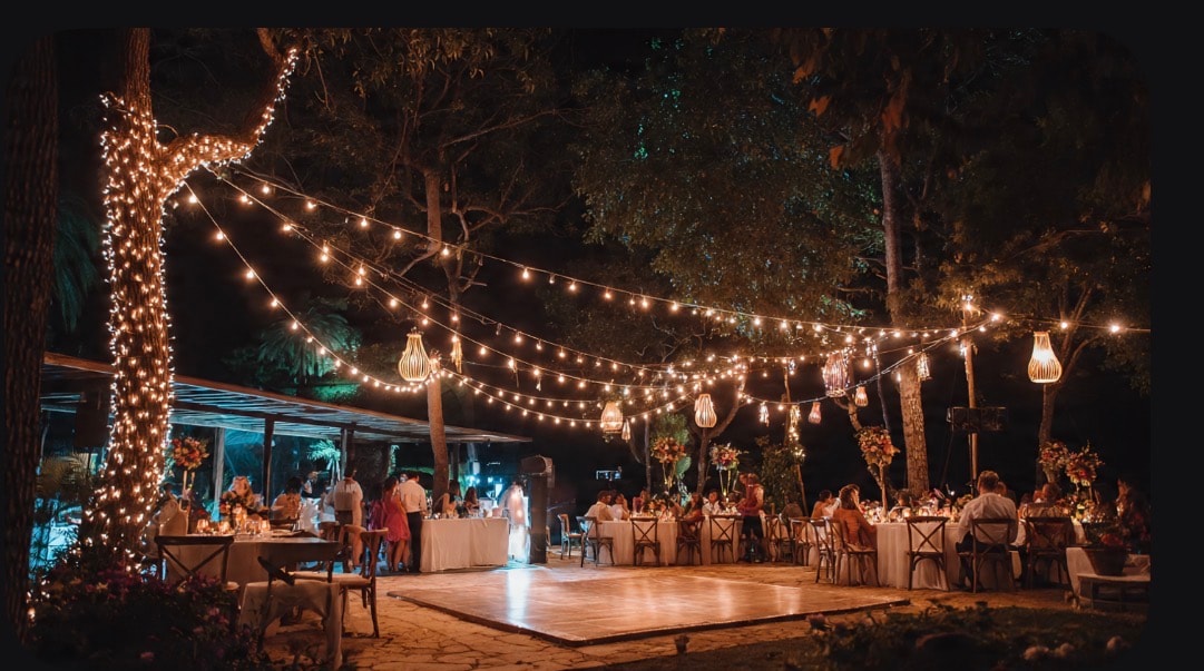 Wedding ceremony outdoors with floral arch